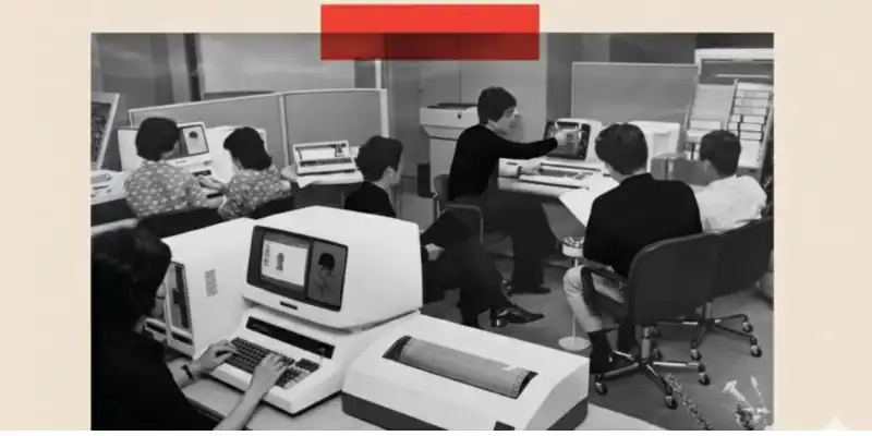 Office workers spend long hours at computers during the AI gold rush